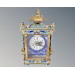 A Champlève enamel mantel clock with battery movement.