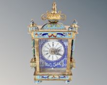 A Champlève enamel mantel clock with battery movement.