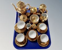 A tray containing continental gold plated tea china.