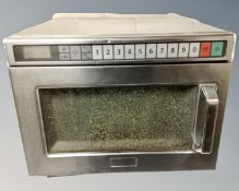 A commercial stainless steel microwave.