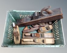 A crate containing seven woodworking planes.