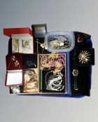 A tray containing costume jewellery, lady's wristwatch, bead necklaces.