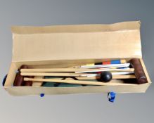 An Excel croquet set in cardboard and pine box.