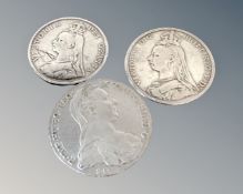 An 1892 Victorian silver crown, an 1889 half crown and reproduction Maria Teresa coin.