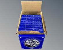 A box containing a collection of boxed Ringtons blue and white plates.