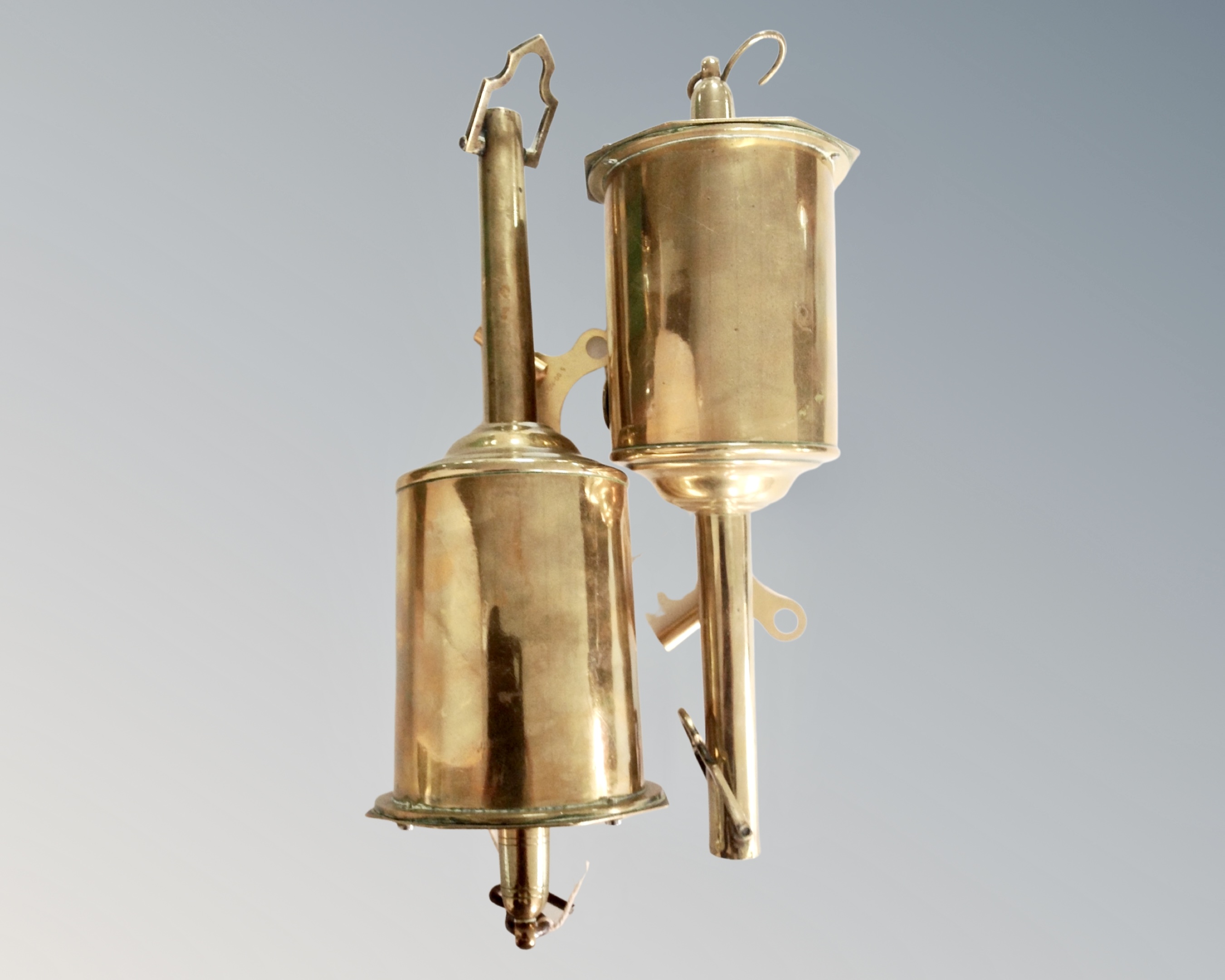 Two brass spit jacks.