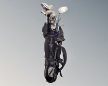 A golf bag containing assorted irons and drivers.