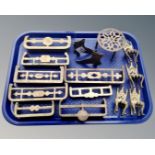 A tray of brass items including circular trivet, miniature chairs, miniature fire grates etc.