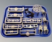 A tray of brass items including circular trivet, miniature chairs, miniature fire grates etc.