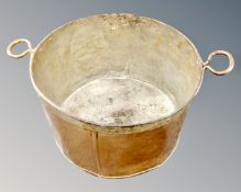 A 19th century twin handled copper cooking pot.