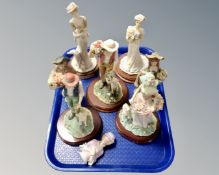 A tray of Bisque porcelain figurines including Leonardo collection, china dollytopper etc.
