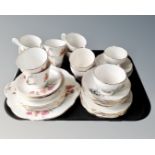 A tray containing Windsor Chrysanthemum and Roslyn part tea sets.