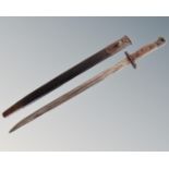 A World War I Wilkinson 1907 sword bayonet in sheath.