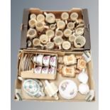 Two boxes containing a large quantity of German pottery steins, cottageware three piece tea set,