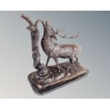 A cast bronze figure of a stag on black marble base (height 41cm)