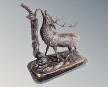 A cast bronze figure of a stag on black marble base (height 41cm)