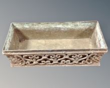 A cast iron rectangular planter with lead liner.