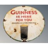 A Guinness Is Here For You enamelled metal circular sign.