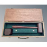 A wooden gavel and block in teak presentation box.