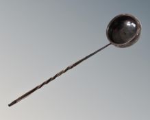 A toddy ladle with turned horn handle.