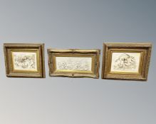 Three gilt framed relief plaques depicting cherubs, largest measures 83cm wide.