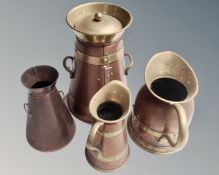 Two brass and copper jugs and two similar vessels.