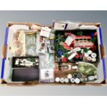 A box containing model railway building accessories and parts, two Britains bagpiper figures.