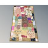 A patchwork wall hanging, 150cm by 90cm.