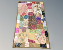 A patchwork wall hanging, 150cm by 90cm.