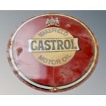 A Castrol Motor Oil circular enamelled sign.