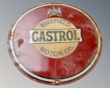 A Castrol Motor Oil circular enamelled sign.