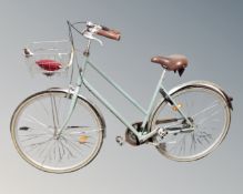 A vintage lady's shopper bike.