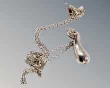 A solid silver necklace with silver drop leaf pendant.