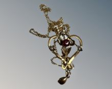 A 9ct gold Art Nouveau necklace set with red and white stones (approx 2.75g).