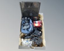 A box containing vintage cameras including Minolta X-300S, Dell laptop, Nikon camera etc.