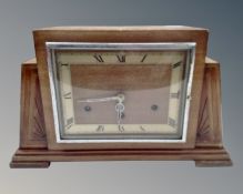 An oak Art Deco mantel clock.