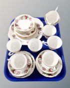 A tray of 21 pieces of Royal Kent bone tea china decorated with roses.