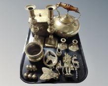 A tray containing brass teapot, tea box, a pair of brass candlesticks, further ornaments.