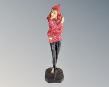 A painted ceramic figure of a jester (height 60cm)