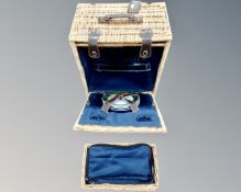 A wicker cased picnic set.