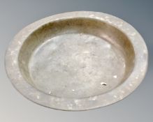 A 19th century copper circular bowl.