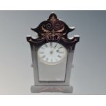 A late Victorian ebonised mantel clock.