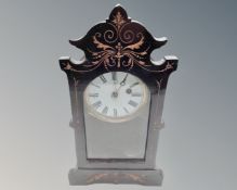 A late Victorian ebonised mantel clock.