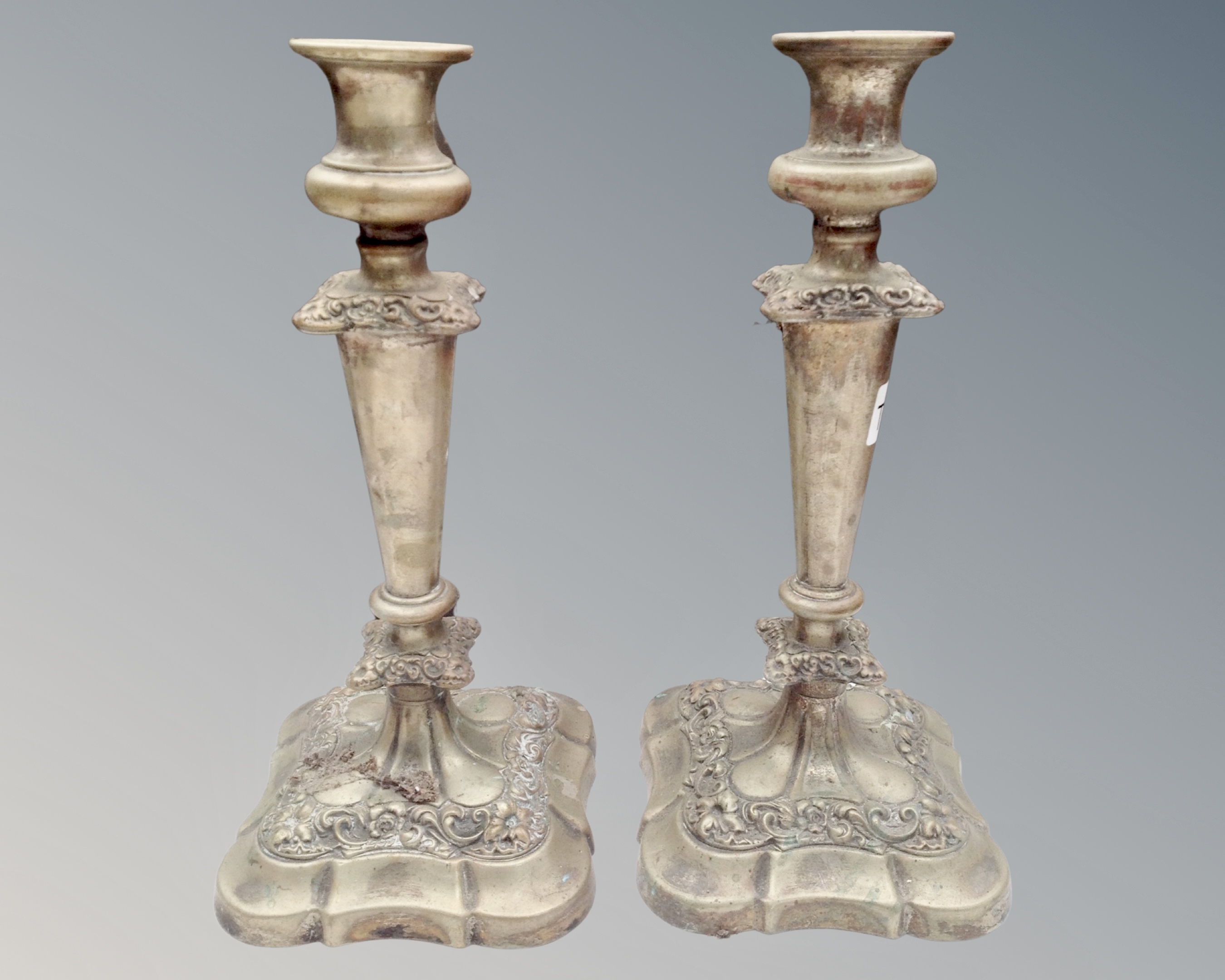 A pair of Victorian plated candlesticks.