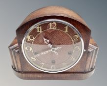 An Art Deco oak eight day mantel clock.