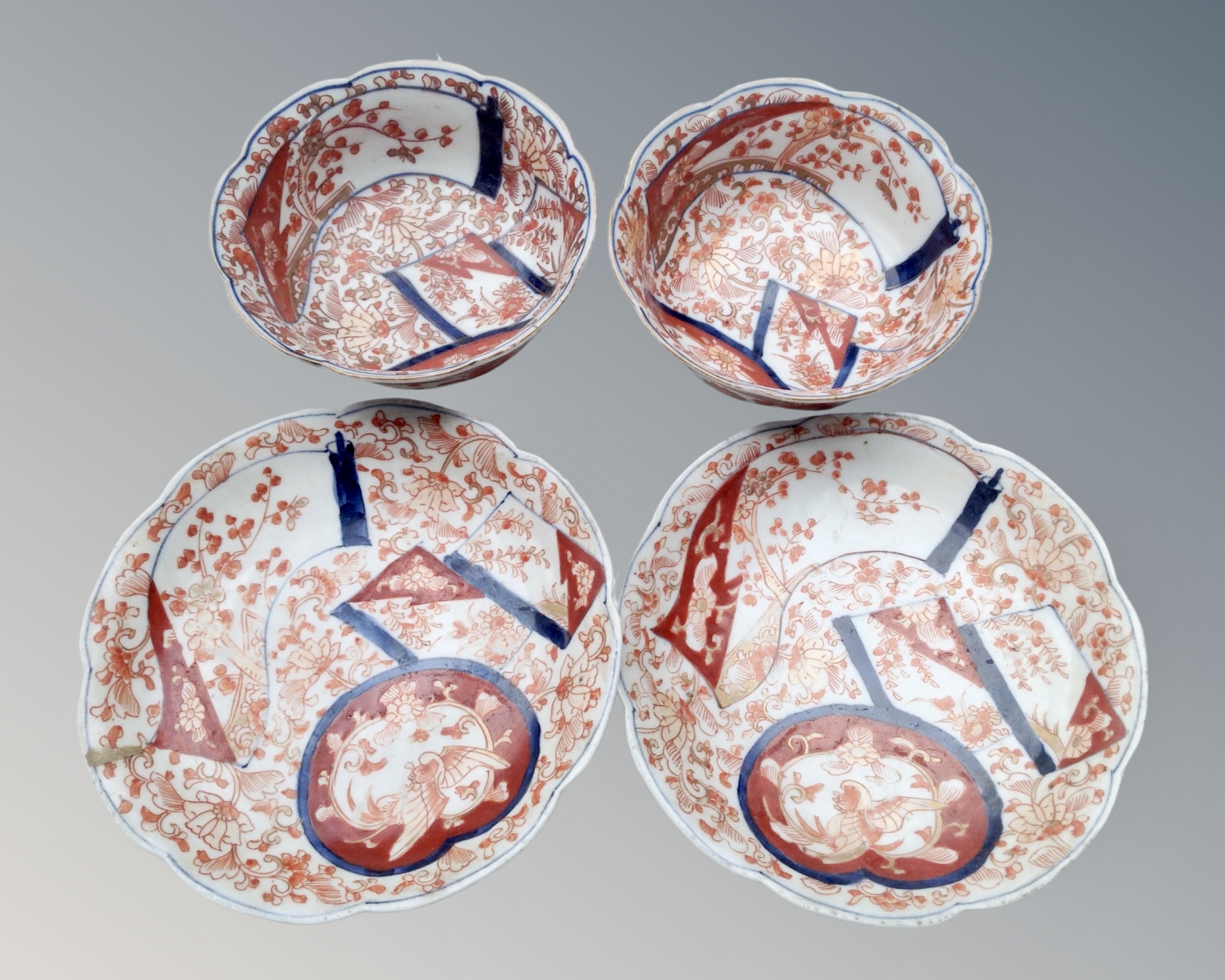 Two 19th century Japanese Imari porcelain tea bowls with saucers.