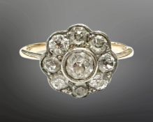 An 18ct gold nine-stone old-cut diamond cluster ring, size L. CONDITION REPORT: 2.