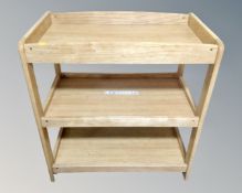 A contemporary Mamas and Papas baby changing stand.
