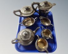 A four piece EPNS tea service together with a similar three piece tea service.
