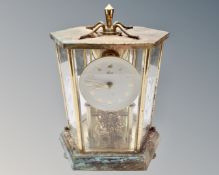 A Kundo brass mantel clock.